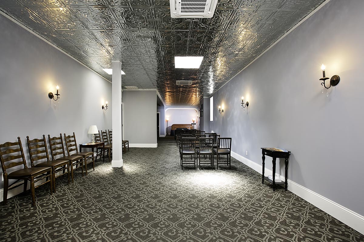 San Jose Funeral Home Chapel with casket in the back